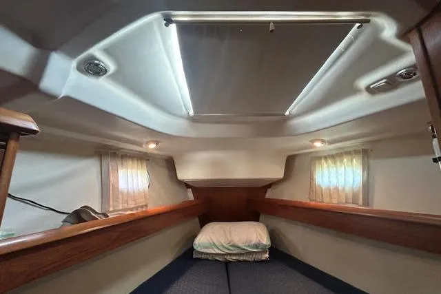 Slide: The Image of Interior cabin of 2005 Jeanneau Deck Salon 43 sailboat, featuring cozy sleeping area. - 25