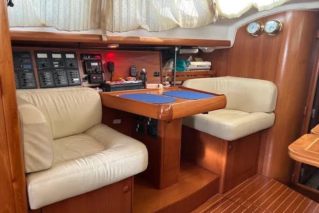 Slide: The Image of Interior of 2005 Jeanneau Deck Salon 43 with seating and navigation equipment. - 38