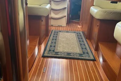 Slide: The Image of Interior of 2005 Jeanneau Deck Salon 43 with wood flooring and seating. - 47