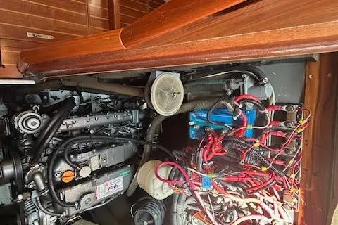 Slide: The Image of Engine compartment of a 2005 Jeanneau Deck Salon 43 sailboat, showcasing wiring and components. - 50