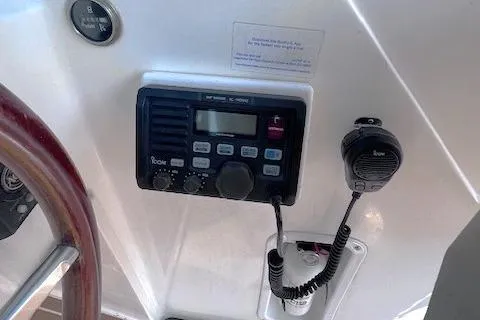 Slide: The Image of 2004 Hunt Yachts Surfhunter 25 dashboard with radio and microphone. - 12