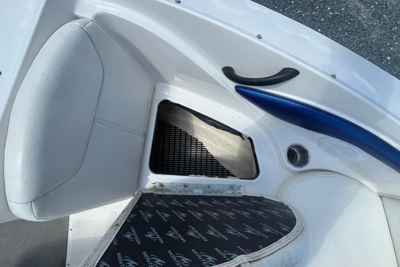 Slide: The Image of 2013 Monterey 184FS boat interior with storage compartment and seating. - 19