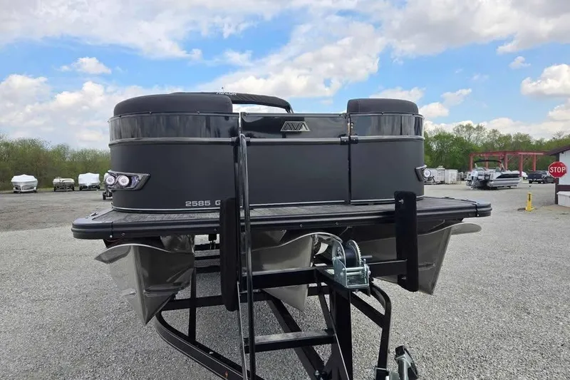Slide: The Image of 2025 Avalon Catalina QUAD LOUNGER SHIFT pontoon boat on trailer, outdoor setting. - 3