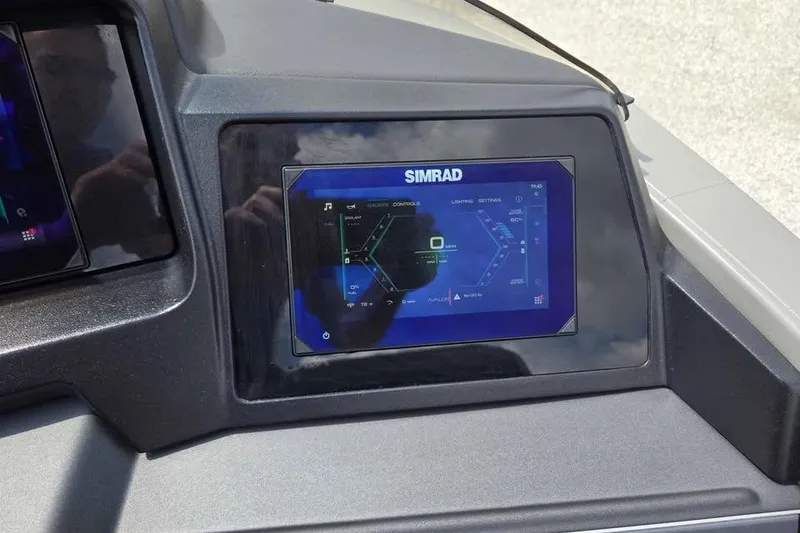 Slide: The Image of Simrad display on 2025 Avalon Catalina QUAD LOUNGER SHIFT dashboard, showing navigation interface. - 8