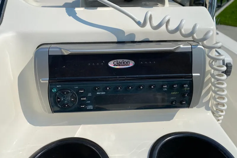 Slide: The Image of Clarion audio system on 2001 Boston Whaler 18 Dauntless boat dashboard. - 25