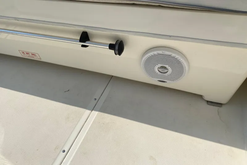 Slide: The Image of 2001 Boston Whaler 18 Dauntless boat interior with speaker and railing detail. - 41