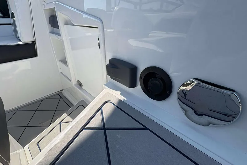 Slide: The Image of 2017 Monterey 298SS boat interior with sleek white design and modern fittings. - 5