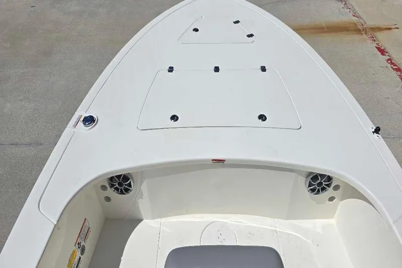 Slide: The Image of 2026 Mako 18 Pro Skiff boat deck with storage compartments and speakers. - 60