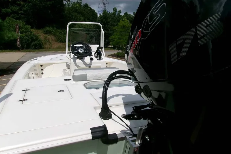 Slide: The Image of 2026 Mako 18 Pro Skiff boat with powerful engine, steering console, and spacious deck. - 6