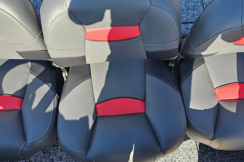 Slide: The Image of 2026 Tracker Pro Team 175 Crappie Edition boat seats, black with red accents. - 10