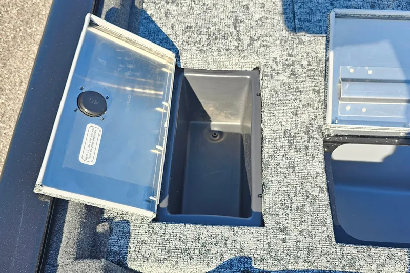 Slide: The Image of Open storage compartment on 2026 Tracker Pro Team 175 Crappie Edition boat. - 12