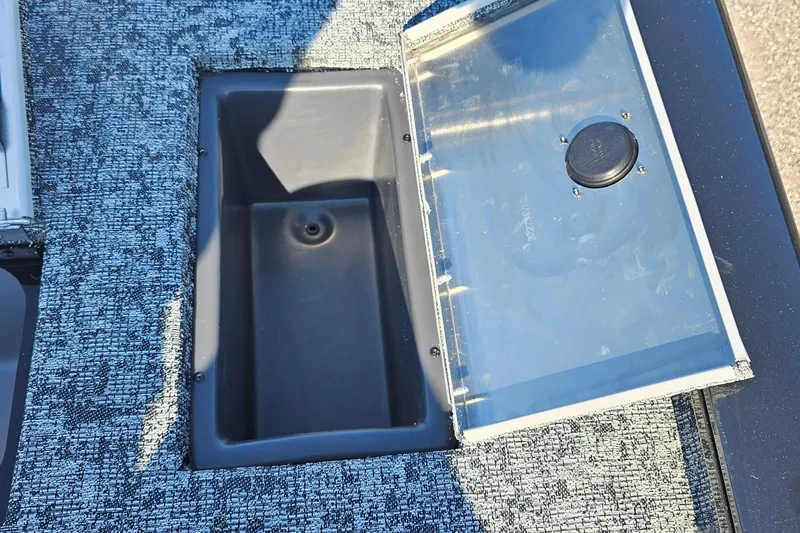 Slide: The Image of Open storage compartment on 2026 Tracker Pro Team 175 Crappie Edition boat. - 14