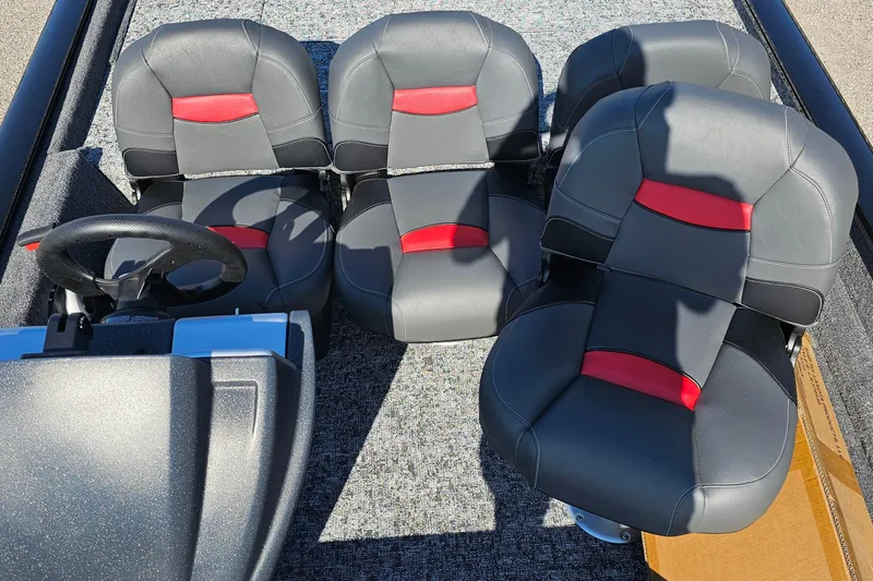 Slide: The Image of 2026 Tracker Pro Team 175 Crappie Edition boat interior with four black and red seats. - 9