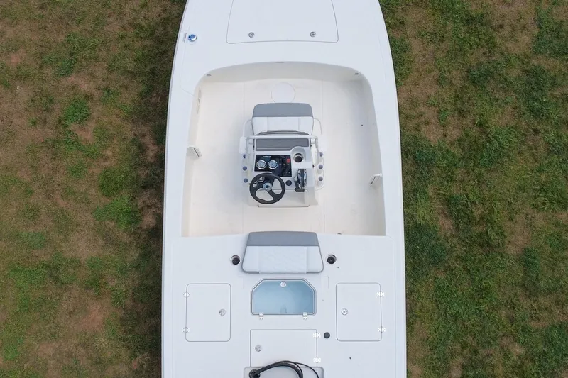 Slide: The Image of Top view of a 2026 Mako 18 Pro Skiff boat on grass. - 4