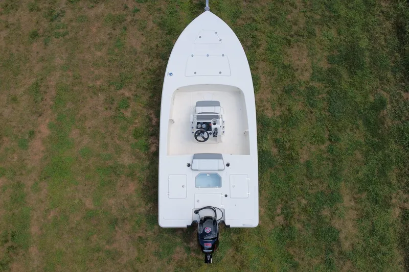 Slide: The Image of Top view of a 2026 Mako 18 Pro Skiff boat on grass. - 5
