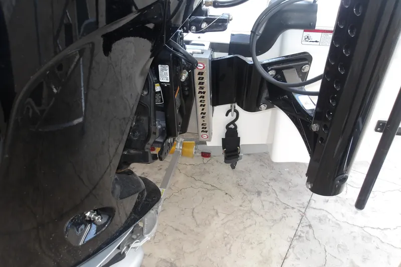 Slide: The Image of Close-up of a 2026 Mako 18 Pro Skiff boat engine and mounting hardware. - 9