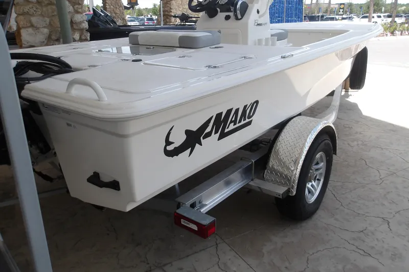 Slide: The Image of 2026 Mako 18 Pro Skiff boat on trailer, featuring sleek design and durable construction. - 7