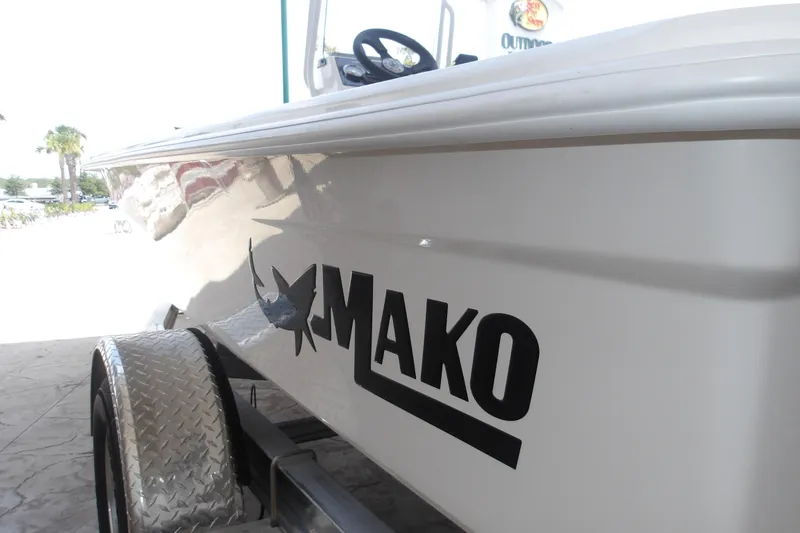 Slide: The Image of 2026 Mako 18 Pro Skiff boat on trailer, side view with logo. - 12