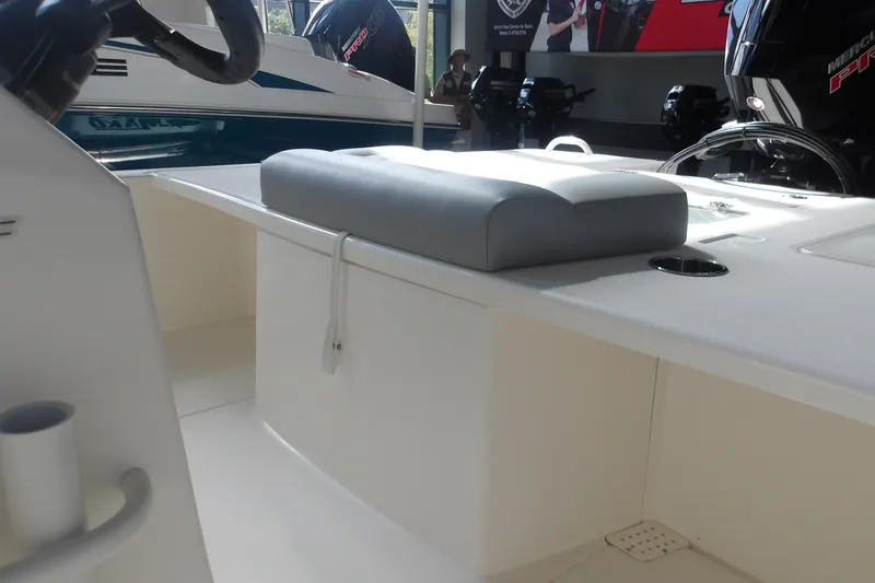 Slide: The Image of 2026 Mako 18 Pro Skiff interior with cushioned seating and modern design. - 15