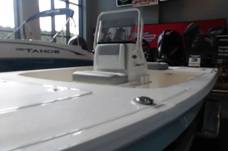 Slide: The Image of 2026 Mako 18 Pro Skiff boat displayed indoors, featuring sleek design and modern seating. - 3