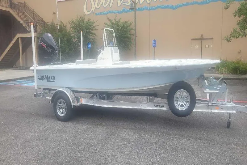 The Image of 2026 Mako 18 Pro Skiff boat on trailer, parked outdoors. - 0