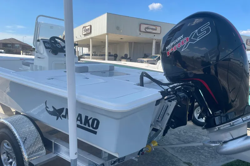 Slide: The Image of 2026 Mako 18 Pro Skiff boat with Mercury Pro XS engine on trailer. - 3