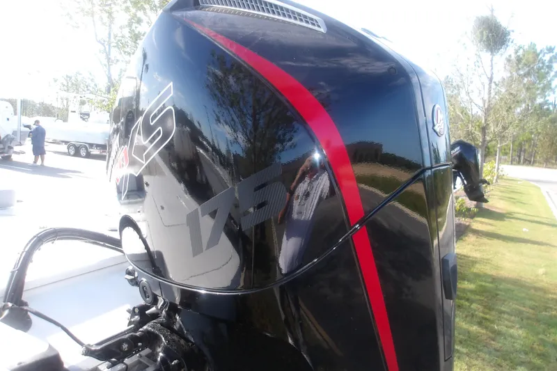 Slide: The Image of Outboard motor on a 2026 Mako 18 Pro Skiff, featuring a sleek black and red design. - 8
