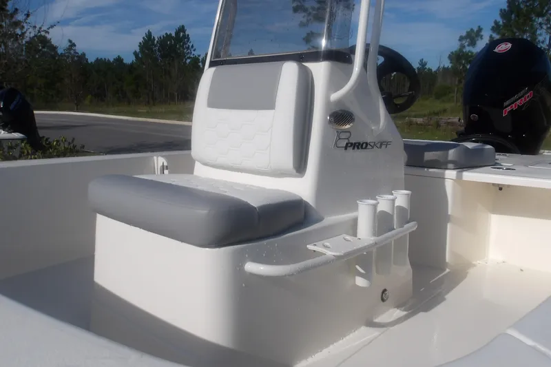 Slide: The Image of 2026 Mako 18 Pro Skiff boat interior with seating and rod holders. - 15