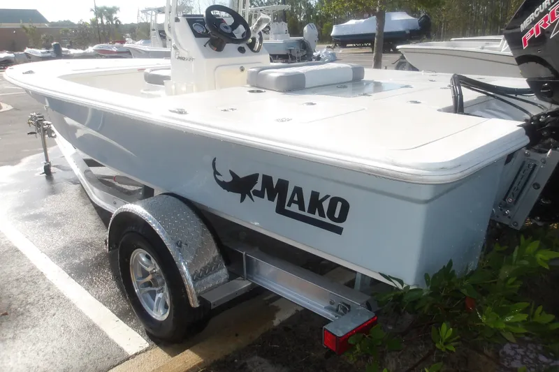 Slide: The Image of 2026 Mako 18 Pro Skiff boat on trailer, featuring sleek design and modern features. - 7