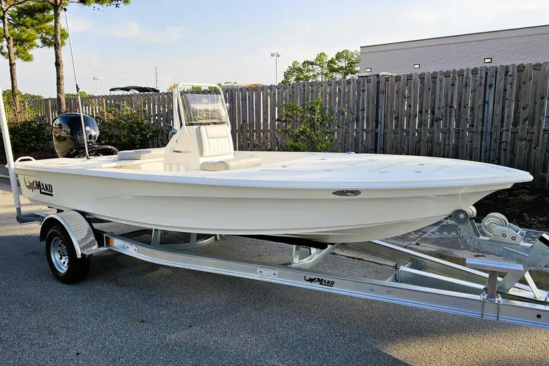 The Image of 2026 Mako 18 Pro Skiff boat on trailer, parked outdoors. - 0