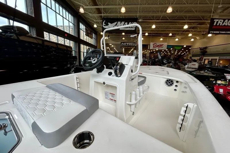 Slide: The Image of 2026 Mako Pro Skiff 18 boat with Mercury Pro XS engine in showroom. - 5