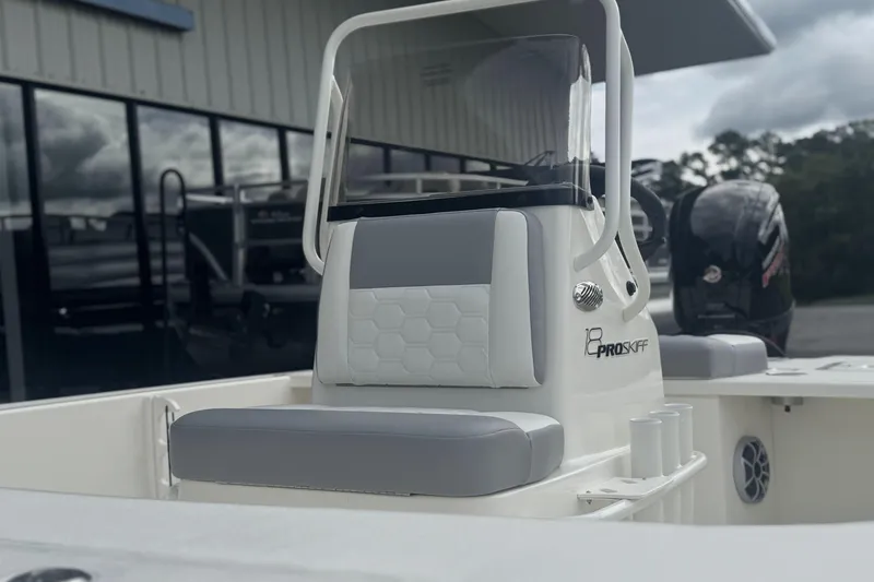 Slide: The Image of 2026 Mako 18 Pro Skiff boat with sleek seating and modern design. - 12