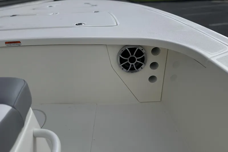 Slide: The Image of 2026 Mako 18 Pro Skiff interior with speaker and seating detail. - 14