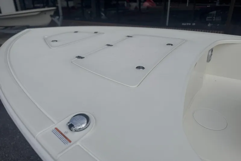 Slide: The Image of 2026 Mako 18 Pro Skiff boat deck with storage compartments and sleek design. - 6