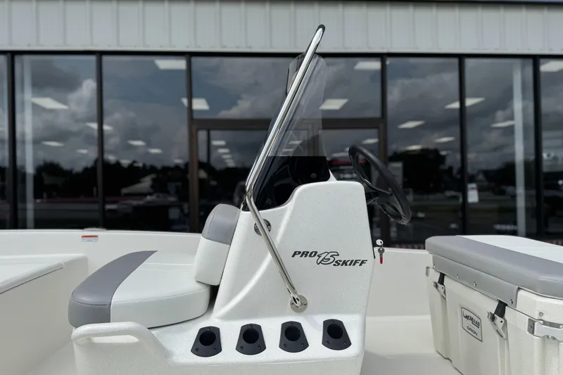 Slide: The Image of 2026 Mako Pro Skiff 15 CC boat console with seating and storage. - 10