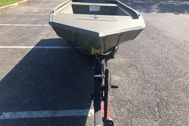 Slide: The Image of 2026 Tracker Grizzly 1648 Utility boat on trailer in parking lot. - 5