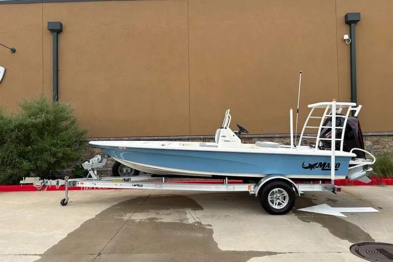The Image of 2026 Mako 18 Pro Skiff boat on trailer, parked outdoors. - 0