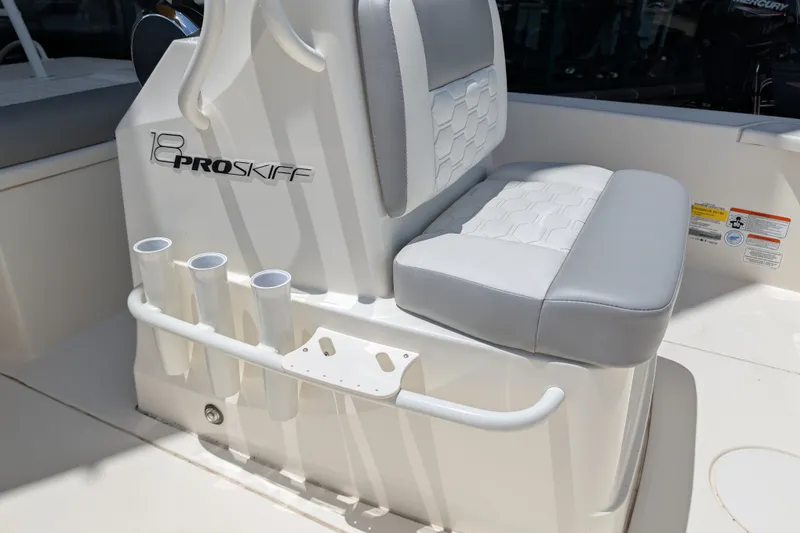 Slide: The Image of 2026 Mako 18 Pro Skiff boat seat with rod holders and sleek design. - 13
