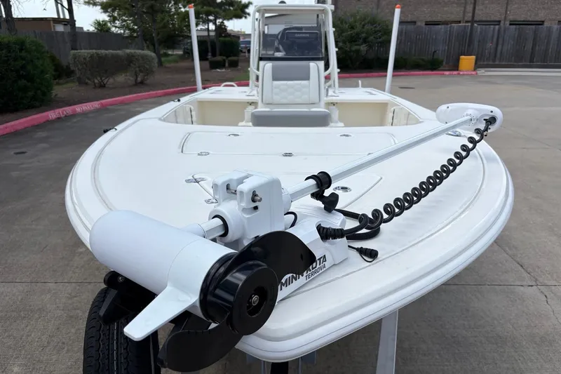Slide: The Image of 2026 Mako 18 Pro Skiff with Minn Kota Terrova trolling motor on display. - 1