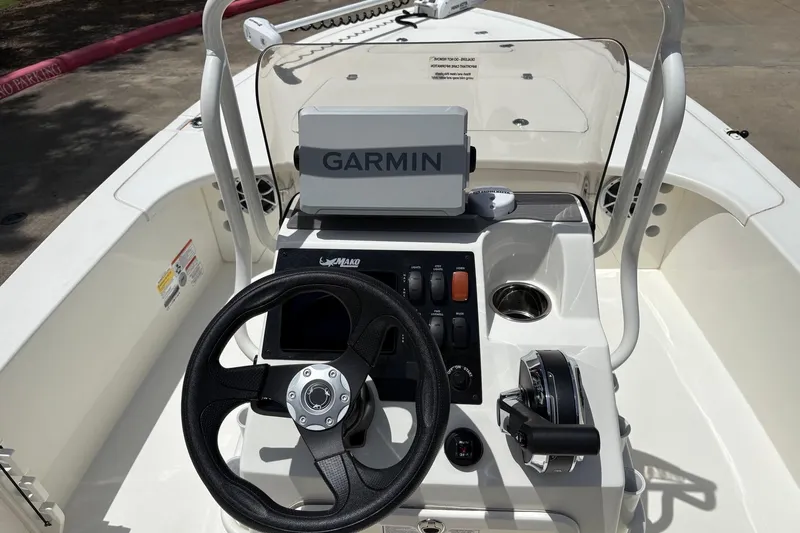 Slide: The Image of 2026 Mako 18 Pro Skiff boat console with Garmin navigation system. - 6