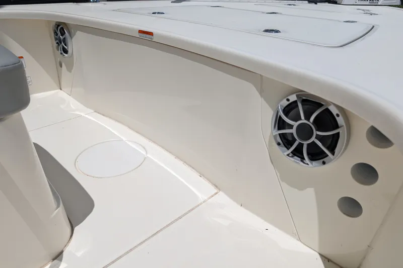 Slide: The Image of 2026 Mako 18 Pro Skiff interior with speakers and storage compartments. - 12