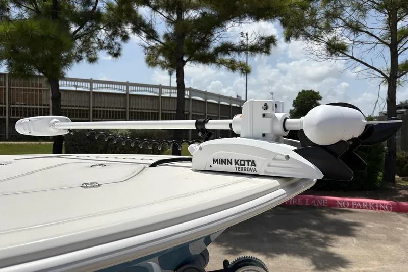 Slide: The Image of Minn Kota Terrova trolling motor on 2026 Mako 18 Pro Skiff boat, parked outdoors. - 4