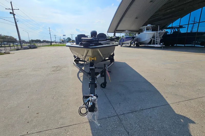 Slide: The Image of 2026 Tracker Pro Team 175 Crappie Edition boat on trailer in outdoor showroom. - 3