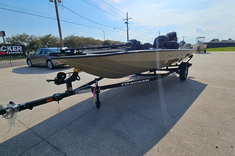 Slide: The Image of 2026 Tracker Pro Team 175 Crappie Edition boat on trailer in parking lot. - 4
