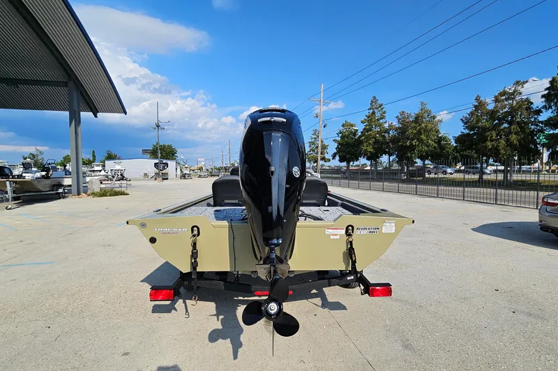 Slide: The Image of 2026 Tracker Pro Team 175 Crappie Edition boat, rear view, parked outdoors under blue sky. - 8