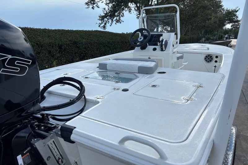 Slide: The Image of 2026 Mako 18 Pro Skiff boat with sleek design and modern console. - 7