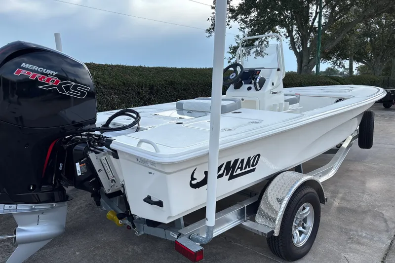 Slide: The Image of 2026 Mako 18 Pro Skiff boat with Mercury Pro XS engine on trailer. - 6