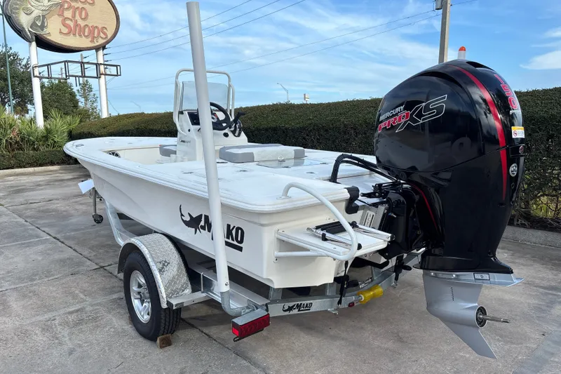 Slide: The Image of 2026 Mako 18 Pro Skiff boat with Mercury Pro XS engine on trailer. - 2