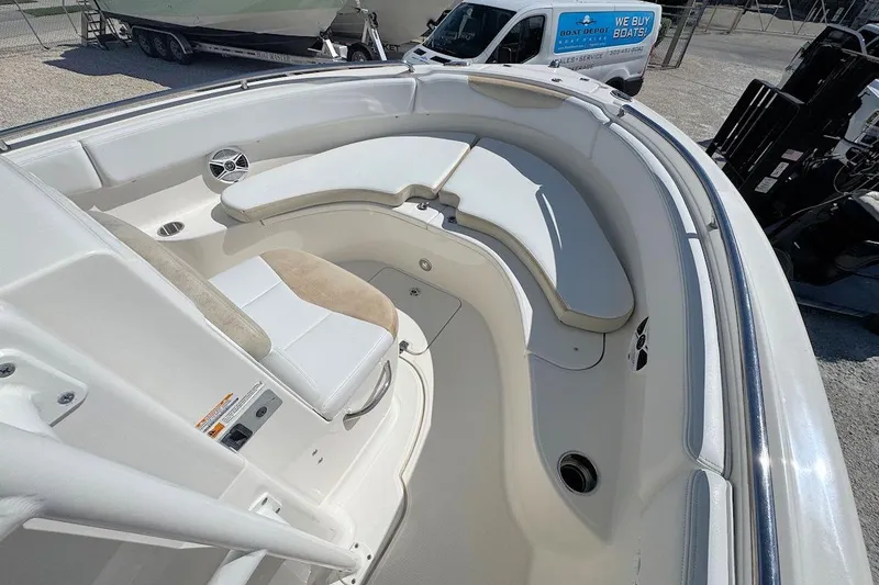 Slide: The Image of 2016 Robalo R222 Center Console boat interior with cushioned seating and speaker. - 10