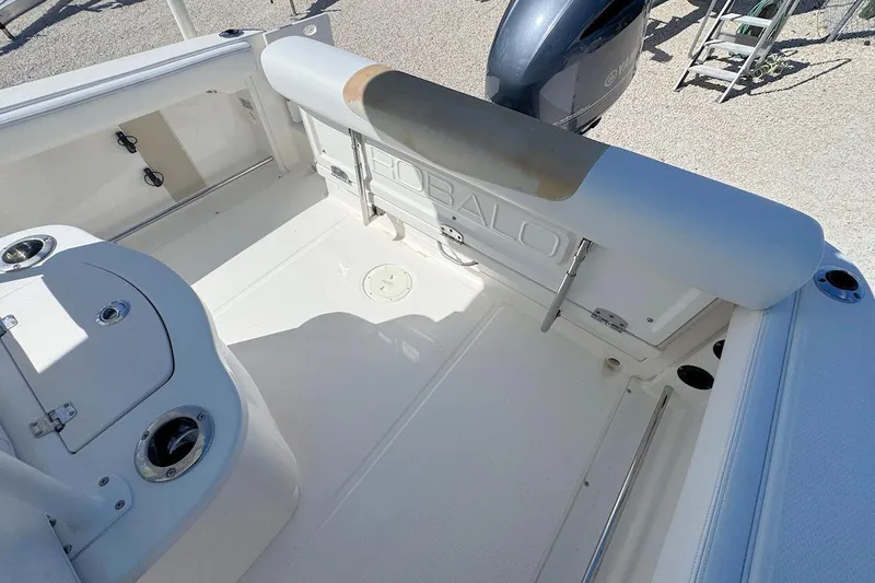 Slide: The Image of 2016 Robalo R222 Center Console boat interior with seating and storage compartments. - 6